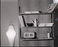 Cifra 5 electric "split-flap" clock (on shelf) by Nani and Gino Valle [it] for R.E.C. Solari (1956 Award)[34]