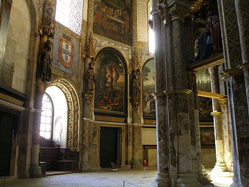 Church ambulatory with Renaissance paintings.