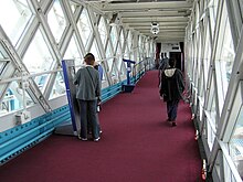 Interior of high-level walkway in 2005 (used as an exhibition space) prior to glass floors Tower.bridge.9.walkwaysinterior.london.arp.jpg