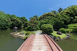 Wooden footbridge in Shinjuku Gyo-en