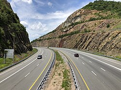 Sideling Hill man-made mountain pass on I-68/U.S. 40 near Hancock 2019-07-14 13 12 11 View west along Interstate 68 and U.S. Route 40 (National Freeway) from the Victor Cushwa Memorial Bridge as it passes through the Sideling Hill Road Cut in Forest Park, Washington County, Maryland.jpg