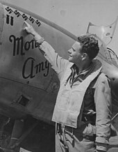 Herbert Hatch pointing to the five victory marks on his P-38 342-FH 000142 (cropped).jpg