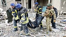 First responders transporting the body of a resident after Russian shelling in November 2023 Avdiivka after Russian shelling, 2023-11-09 (05).jpg