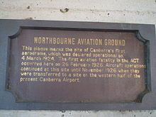 This sign in Dickson, Australian Capital Territory commemorates the establishment of Canberra's first aerodrome and its first fatality in the 1920s. Dickson library plaque ACT.jpg