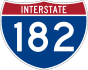 Highway marker for Interstate 182, comprising a wide blue shield with a red, three-pointed crown