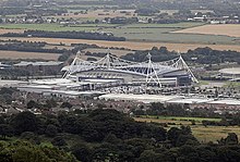 Bolton Wanderers F.C. are based at the University of Bolton Stadium, in Horwich. Reebok Stadium from Crooked Edge Hill.jpg
