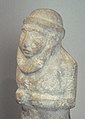 A simple portrait of a probable, unknown priest-king with a brimmed round hat and large beard (dated to c. 3300 BCE). Currently located in the Louvre Museum.