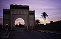 A Rissani city gate at dusk, 1990s.