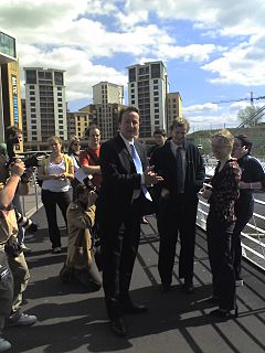 David Cameron campaigning in the 2006 local elections at Newcastle upon Tyne on the Gateshead Millennium Bridge CameronNewcastle.jpg