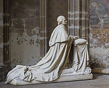 Statue of Desprez kneeling at prayer