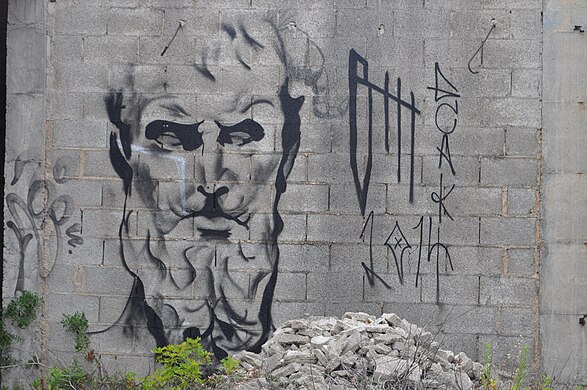 Graffiti on a wall in the abandoned hotel complex, Portinatx in Ibiza, Spain