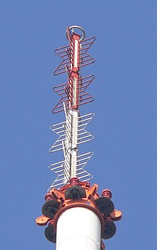A VHF television broadcasting antenna. This is a common type called a super turnstile or batwing antenna. Superturnstile Tx Muehlacker.JPG