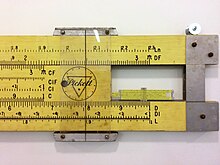 A 2.5 m teaching slide rule compared to a normal sized model Teaching sliderule comparison.jpg