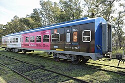 San Martin Line car advertising the 144 emergency telephone number against gender violence Tren San Martin Linea 144.jpg