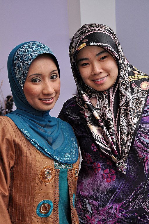 Two Muslim women in tudungs at an engagement party, Brunei - 20100531.jpg