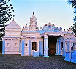 The temple, which stands on a ridge north of the Umgeni river near Durban, has a prominent white spire visible from a great distance. The whole building is finished in white, in contrast to many others which are decorated in various colours. The stucco mo The Narainsamy Temple, Newlands, was founded by one Narainsamy in 1896. It is controlled by a family trust created by him. The designer and builder of the temple was Kristappa Reddy, whose main contribution to temple architecture was this temple with its Architectural style: Traditional Indian. Type of site: Temple Current use: temple. From N2 north take off-ramp to M21, Inanda Road, and turn left to head inland. The Temple is on the. Founded by one Narainsamy in 1896 and designed and built by Kristappa Reddy, this temple has a finel