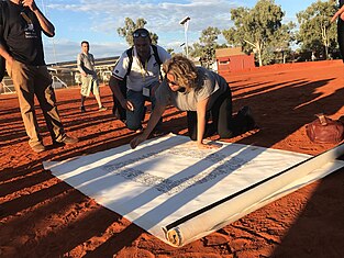 Signing of the Uluru Statement Denise Bowden, Yothu Yindi CEO, signing the Uluru statement.jpg
