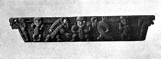 Small Māori carving with figures in a row in different positions