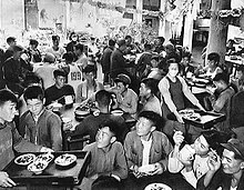 A collective meal in the canteen of a people's commune. People's commune canteen2.jpg