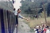 President Bush waves from the train outside of Bowling Green during his whistle-stop campaign.