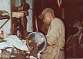 man working at taxidermy table