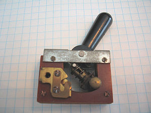 Large toggle switch, depicted in circuit 'open...