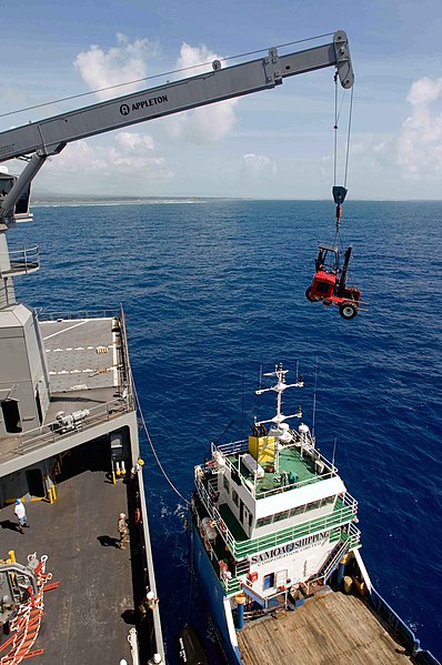 File:US Navy 090630-N-9689V-003 The Military Sealift Command dry cargo-ammunition ship USNS Richard E. Byrd (T-AKE 4) cranes cargo across decks to a local Samoan shipping vessel that will help ferry medical and engineering equipment.jpg