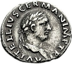 Серая монета с изображением смотрящего вправо мужского лица