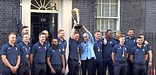 The England team celebrating their 2019 Cricket World Cup success at 10 Downing Street with Theresa May 2019 World Cup winning England Cricket team with PM Theresa May.jpg