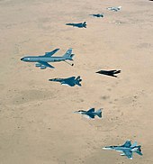 Aircraft of the USAF 379th Air Expeditionary Wing and UK and Australian counterparts stationed together at Al Udeid Air Base, Qatar, in southwest Asia, fly over the desert on 14 April 2003. Aircraft include KC-135 Stratotanker, F-15E Strike Eagle, F-117 Nighthawk, F-16CJ Falcon, British GR-4 Tornado, and Australian F/A-18 Hornet AirForce over Iraq.jpg
