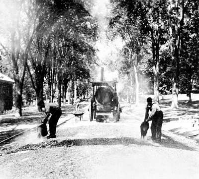Applying bitumen on a stretch of road at Cornell University in 1910.