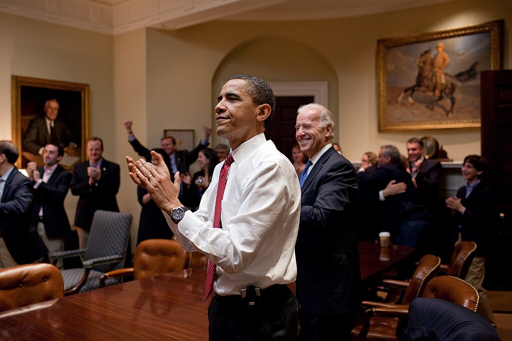 President Obama Appaulds after the Affordable Care Act is passed by Congress