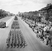 Three column of Britihs troops marching down the Charlottenburg Chaussee in Berlin