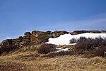 A line of rocks overlooking a plain.