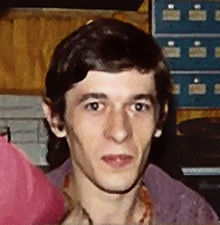 Head and shoulders portrait of a 24-year-old man with short brown hair.