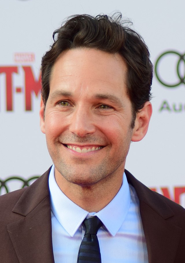 Headshot of Paul Rudd looking off camera and smiling