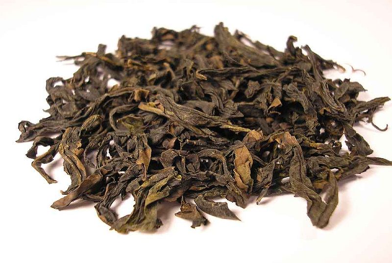 Loose dried Qi Lan Oolong tea leaves.