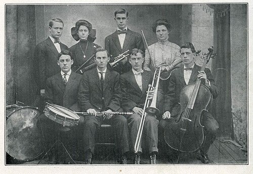Photograph of the orchestra. Back row, left to right: George Cook, Hazel Warren, Fred Keller?, ?. Front row, left to right: ?, Arthur Cook?, Harvey Farmer?, Ralph Cook.