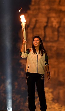 Indonesian badminton legend Susi Susanti carried a torch fire during the Asian Games Torch Relay Concert in Special Region of Yogyakarta, Indonesia Susi Susanti.jpg