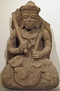 Śiva. Région de Kon Tum. Style de Yang Mum. Vers 1409. H. 85 cm. Musée Guimet[122]