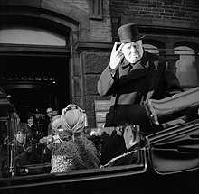 Churchill was initially unaware of the offensive meaning of holding up his hand like in this gesture (1942). Winston Churchill, cigar in mouth, gives his famous 'V' for victory sign during a visit to Bradford, 4 December 1942. H25966.jpg