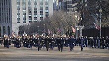 The inaugural parade procession passes the White House Biden inaugural parade.jpg