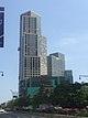 City Point Tower II, a high-rise clad in light-toned stone and dark-toned glass in irregular patterns, viewed from street level