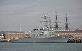 USS Mitscher at Portsmouth in October 2008 with the masts of HMS Victory in the background.