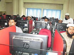 People glued to computers during the Urdu Wikipedia Workshop