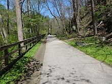 The Grist Mill Trail connects Ellicott City to Elkridge for pedestrians and cyclists. Grist Mill Walking Bridge 01.JPG