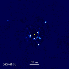 Motion interpolation of seven images of the HR 8799 system taken from the W. M. Keck Observatory over seven years, featuring four exoplanets HR 8799 Orbiting Exoplanets.gif