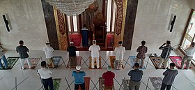 Muslims in Indonesia pray in congregation while imposing to strict protocols during the global pandemic. Physical distancing and the wearing of masks in public is mandatory in Indonesia during the COVID-19 outbreak, including in places of worship Islamic Congregational Prayer with Physical Distancing during the Covid-19 Pandemic.jpg