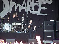 My Chemical Romance, dressed in black, onstage