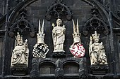 Coats of arms of the Holy Roman Empire and the Bohemian Crown on the Tower of Charles Bridge in Prague. Statues on Old Town Bridge Tower.jpg